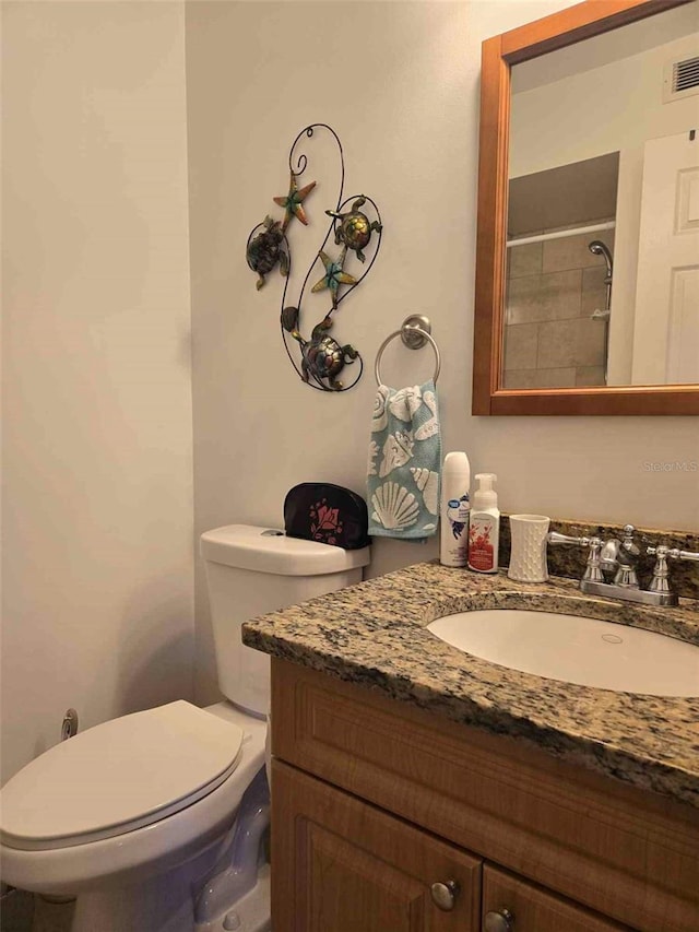 bathroom with toilet and vanity