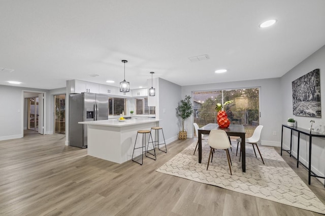 dining space featuring light hardwood / wood-style flooring