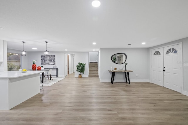 foyer entrance featuring light wood-type flooring