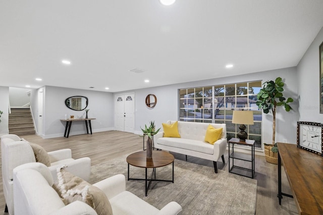 living room with light hardwood / wood-style floors