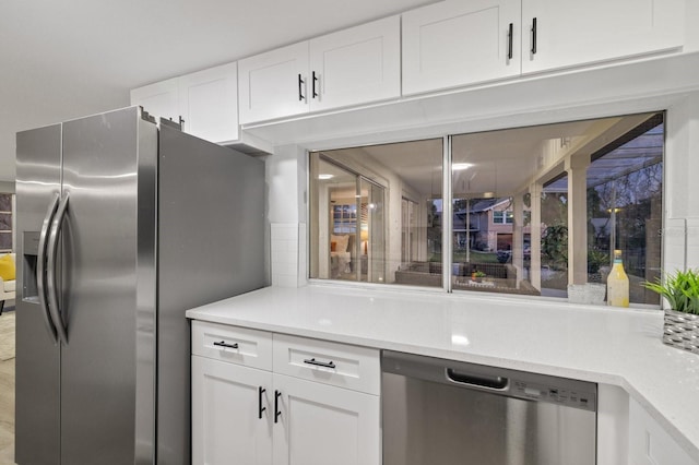 kitchen with white cabinets and stainless steel appliances