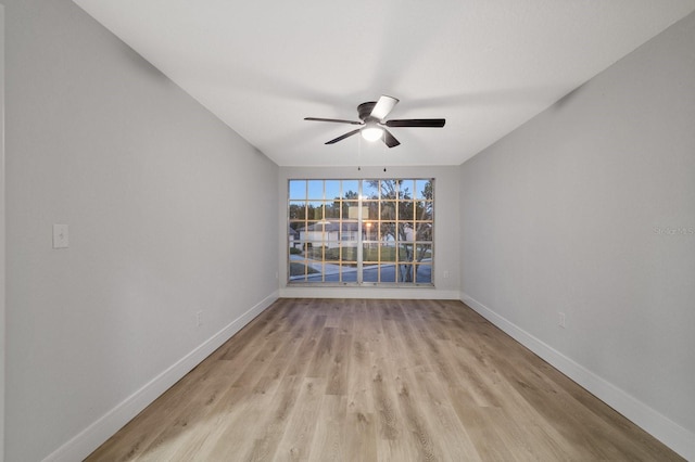 spare room featuring light wood-type flooring and ceiling fan