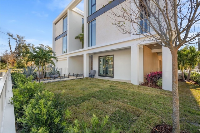 rear view of house with a lawn