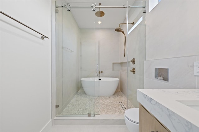 full bathroom with toilet, vanity, and shower with separate bathtub