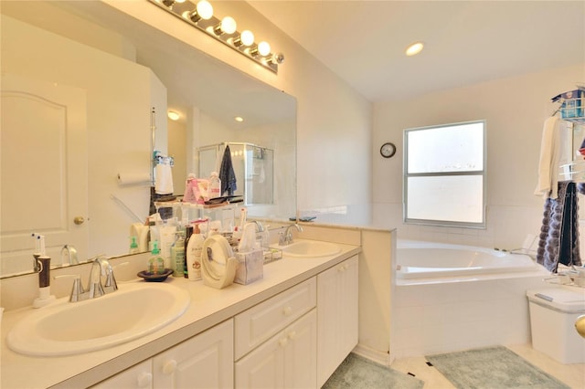 bathroom featuring vanity, independent shower and bath, and tile patterned flooring