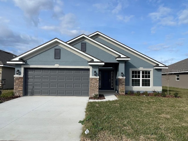 view of front of house with a front lawn and a garage