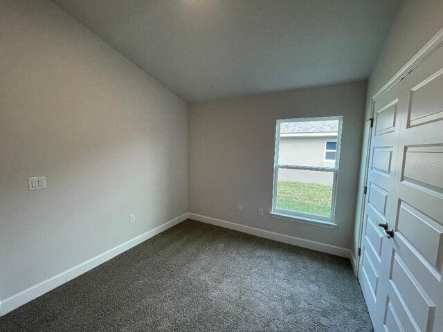 empty room with carpet flooring