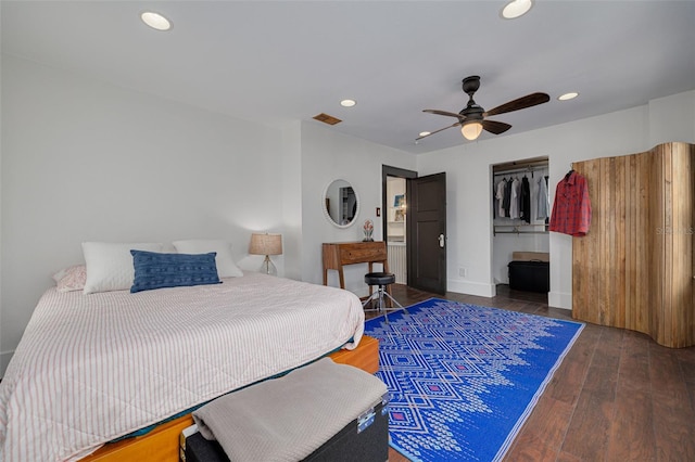 bedroom with ceiling fan, a closet, and dark wood-type flooring