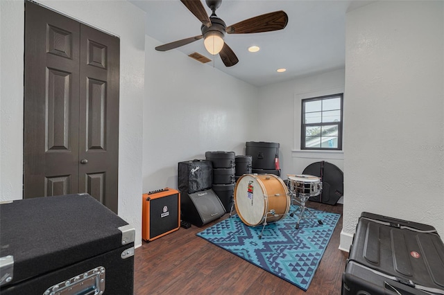 office with ceiling fan and dark wood-type flooring