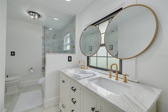 bathroom with toilet, vanity, and an enclosed shower