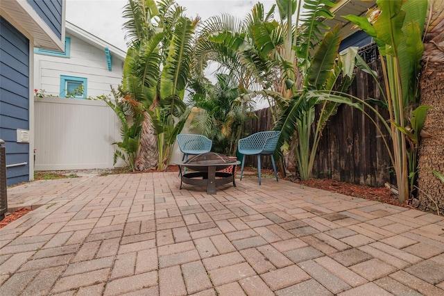 view of patio / terrace featuring a fire pit