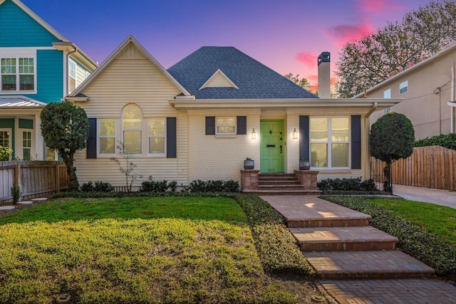 front facade with a yard