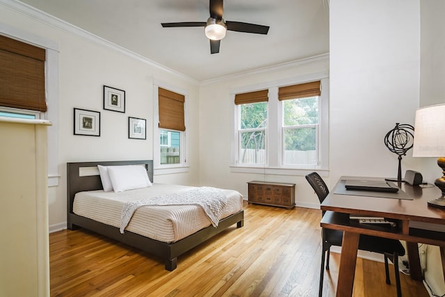 bedroom with ceiling fan, ornamental molding, and light wood-type flooring