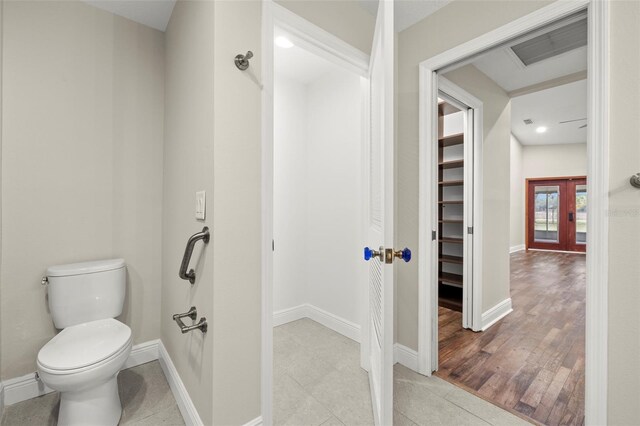 bathroom featuring tile patterned floors and toilet