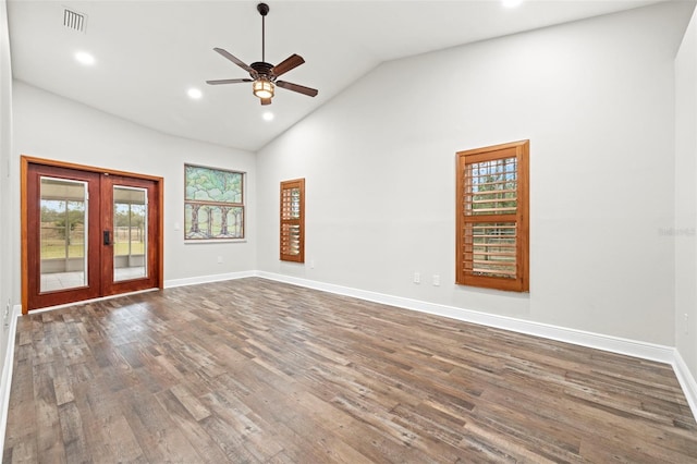 empty room featuring high vaulted ceiling, dark wood-type flooring, ceiling fan, and french doors