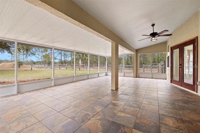 unfurnished sunroom featuring vaulted ceiling and ceiling fan