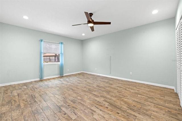 unfurnished room featuring ceiling fan and light hardwood / wood-style floors