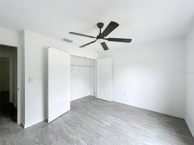 unfurnished bedroom featuring a closet, visible vents, ceiling fan, and baseboards