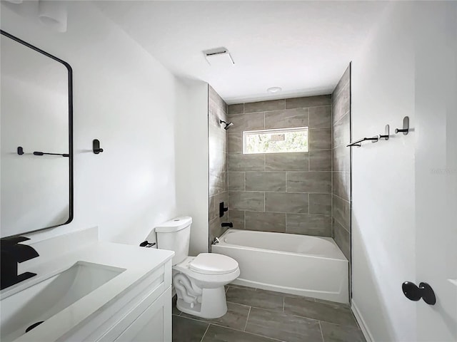 bathroom with shower / bathtub combination, vanity, and toilet