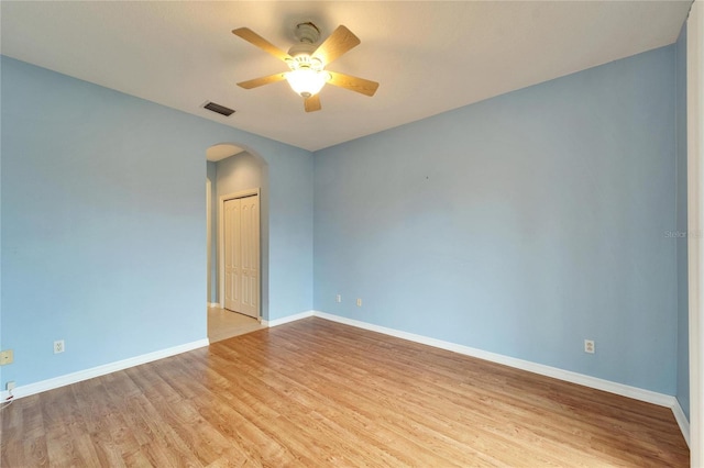 empty room featuring ceiling fan and light hardwood / wood-style floors