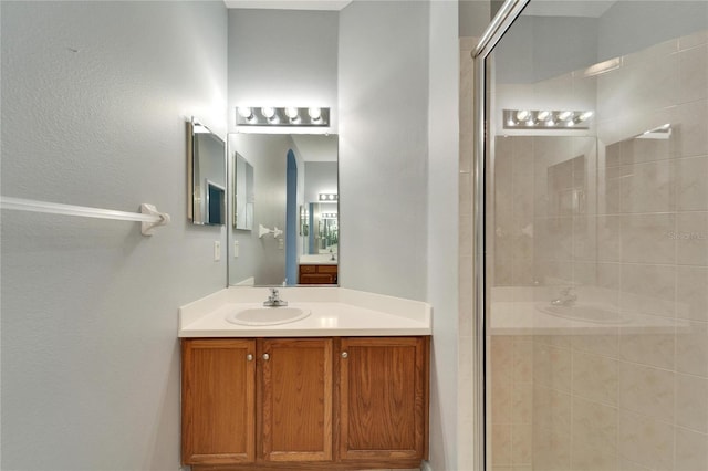 bathroom with vanity and an enclosed shower