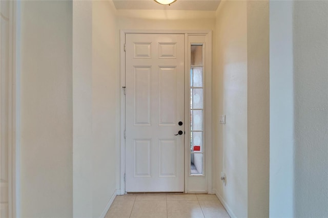 entryway with light tile patterned floors