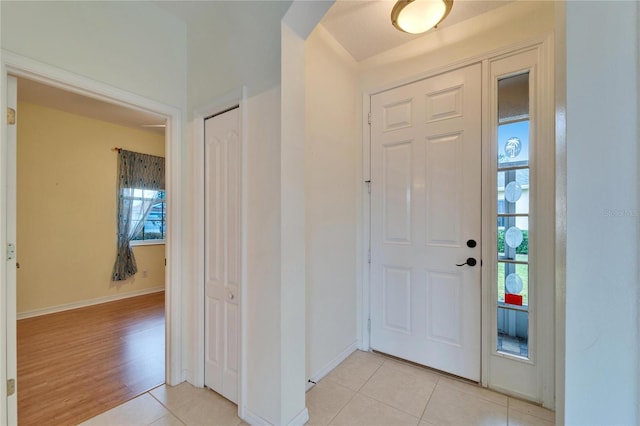 foyer featuring light tile patterned floors