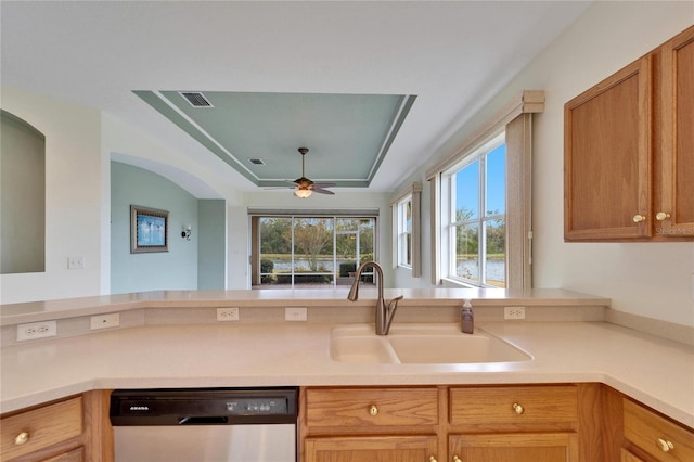 kitchen with ceiling fan, dishwashing machine, and sink