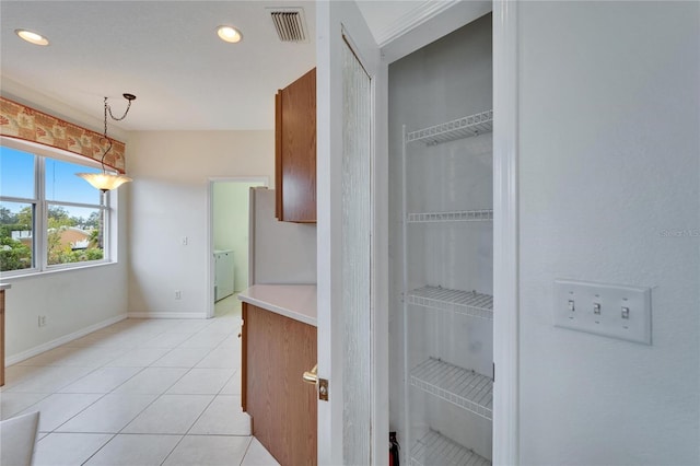 pantry with washing machine and clothes dryer