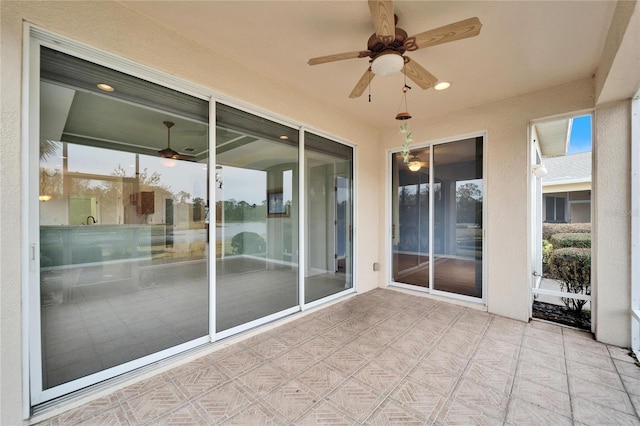 view of patio featuring ceiling fan