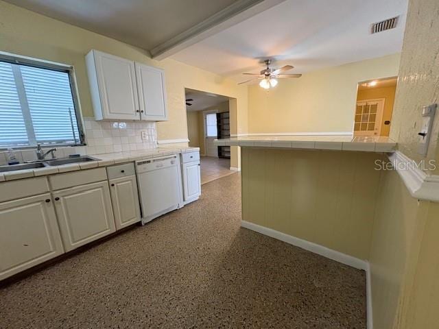 kitchen featuring white cabinets, tasteful backsplash, ceiling fan, tile countertops, and white dishwasher