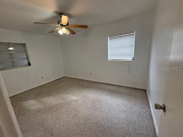 spare room with ceiling fan