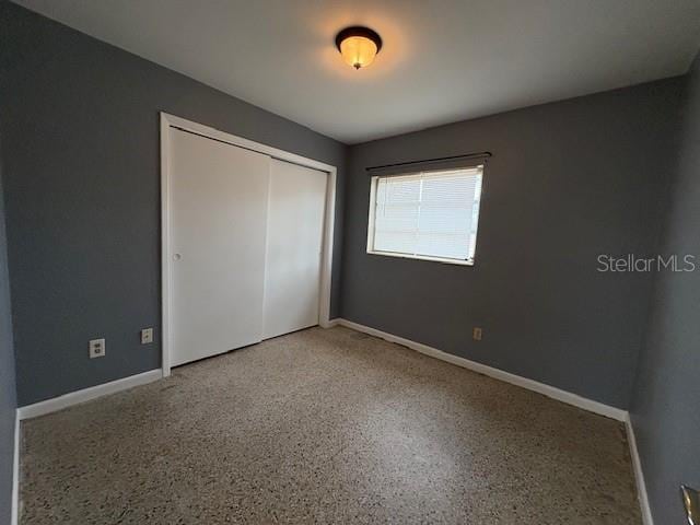 unfurnished bedroom with a closet