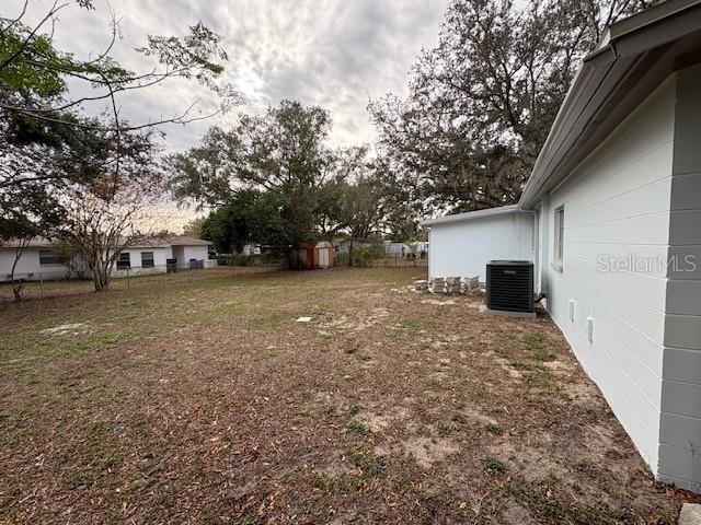 view of yard featuring central AC