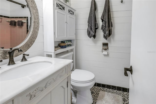 bathroom featuring toilet and vanity