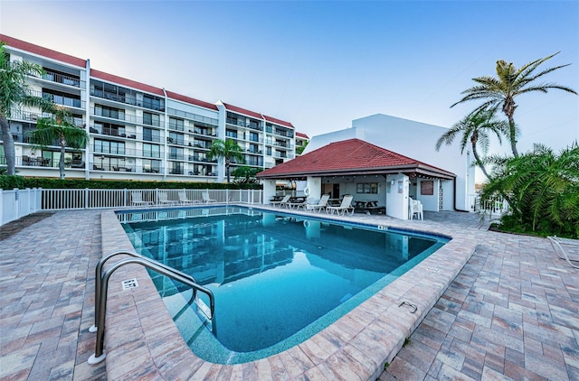 view of swimming pool featuring a patio