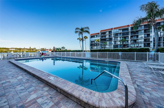 view of swimming pool featuring a patio area