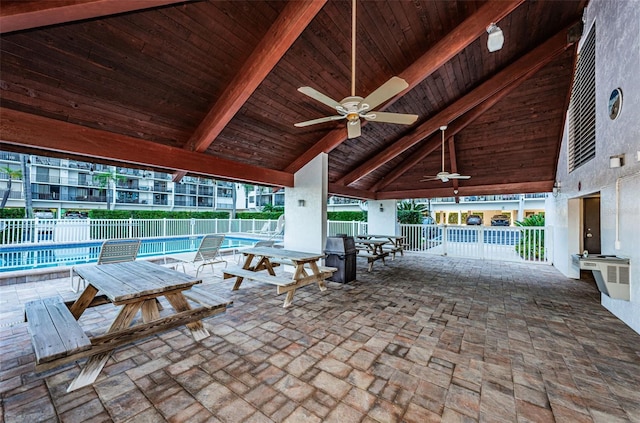 view of patio / terrace with ceiling fan, a gazebo, and a community pool