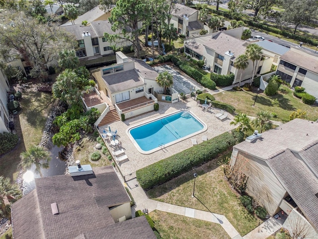 birds eye view of property with a residential view