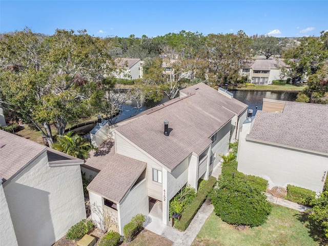 birds eye view of property featuring a water view and a residential view