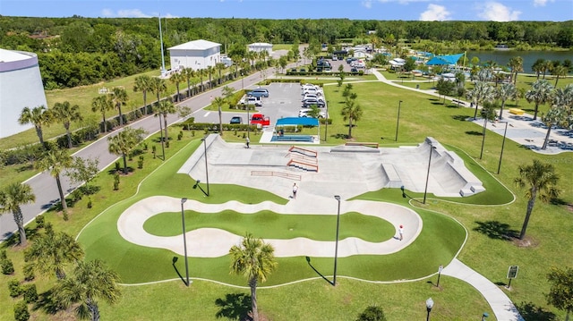 birds eye view of property featuring a water view and a forest view