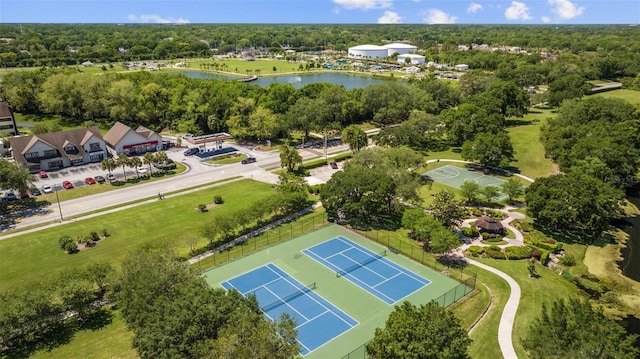 aerial view featuring a water view and a wooded view