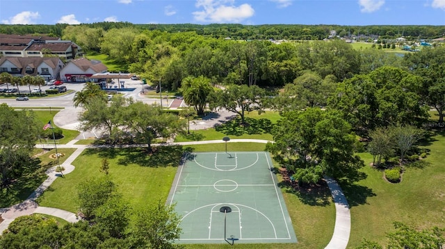 birds eye view of property with a view of trees