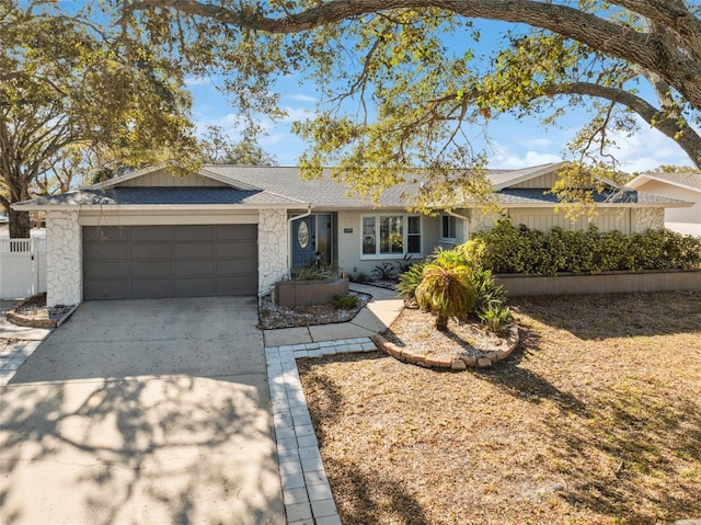 ranch-style home featuring a garage