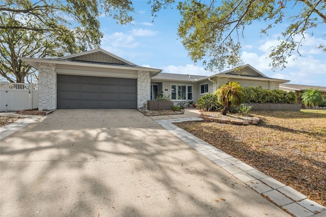 single story home featuring a garage