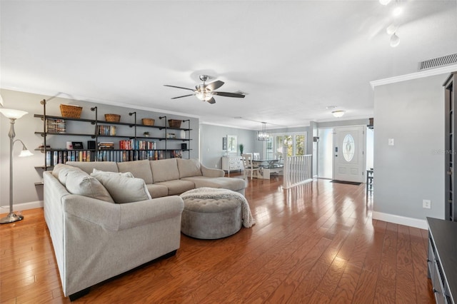 living room with ceiling fan, crown molding, and hardwood / wood-style floors