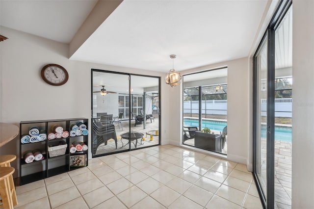 tiled dining area featuring ceiling fan