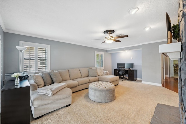 living room with carpet floors, ornamental molding, and ceiling fan