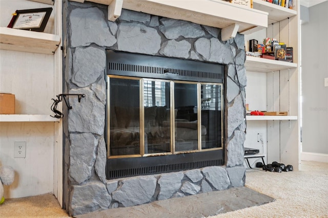 interior details with carpet and a fireplace