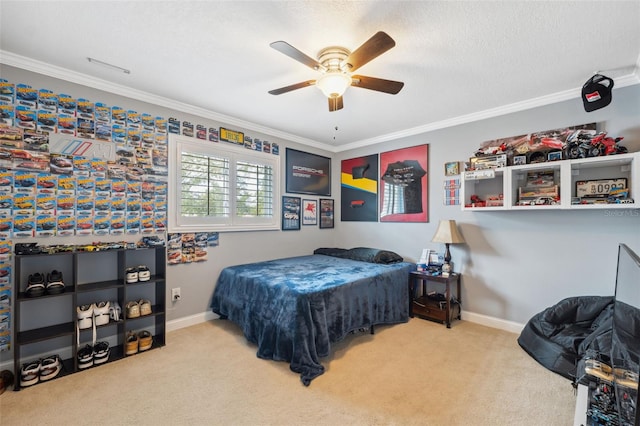 bedroom featuring a textured ceiling, ceiling fan, carpet flooring, and ornamental molding